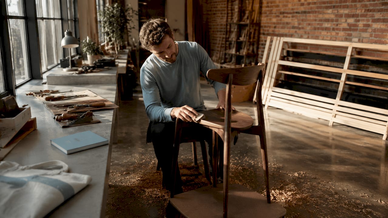 Craftsman sanding luxury custom walnut chair