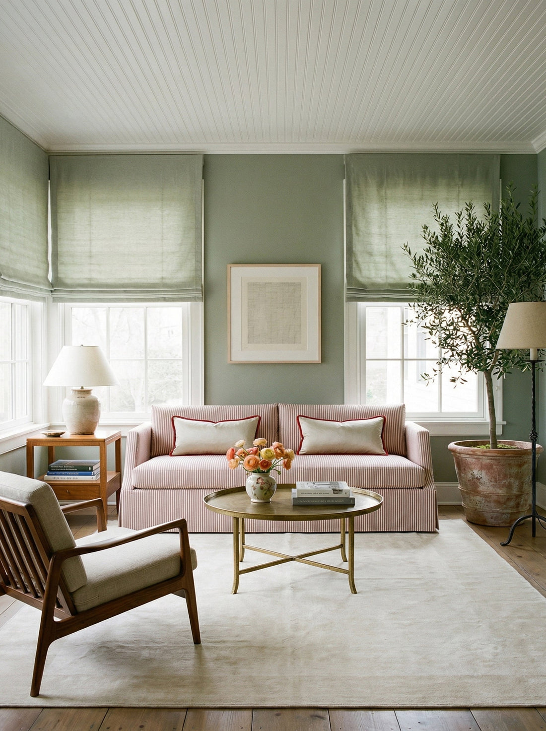 Sage green sunroom in soft morning light
